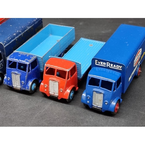 236 - Vintage Diecast: a group of eight Dinky Guy Trucks, to include 'Spratt's' and 'Slumberland' exa... 