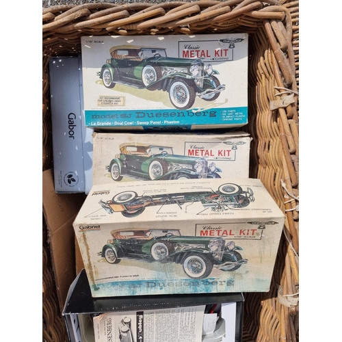 240 - Hubley: four vintage Duesenberg model kits (part assembled), boxed; together with another simil... 