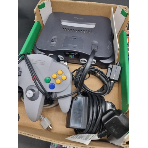 26 - Video Games: a grey Nintendo 64 console with controller, jumper pak, and cables; together with 8 gam... 