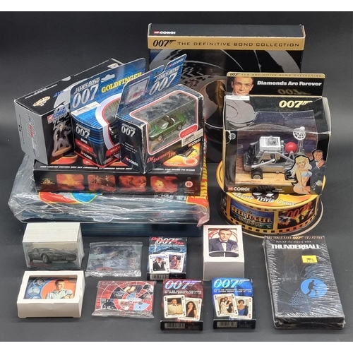 27 - James Bond: a large collection of various 007 memorabilia, to include: 4 boxed Corgi vehicles with a... 