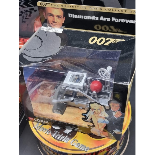 27 - James Bond: a large collection of various 007 memorabilia, to include: 4 boxed Corgi vehicles with a... 