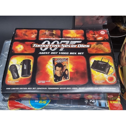 27 - James Bond: a large collection of various 007 memorabilia, to include: 4 boxed Corgi vehicles with a... 