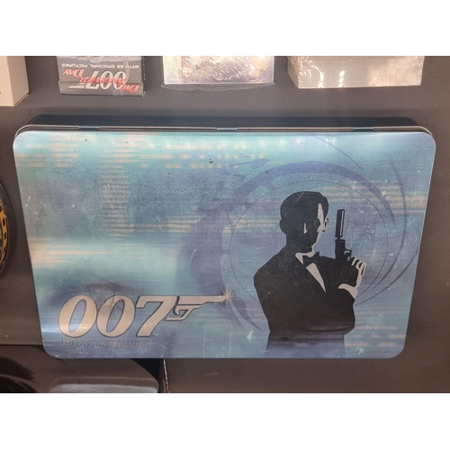 27 - James Bond: a large collection of various 007 memorabilia, to include: 4 boxed Corgi vehicles with a... 