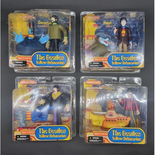 3 - The Beatles: a complete set of 4 'Yellow Submarine' action figures by McFarlane Toys, sealed in... 