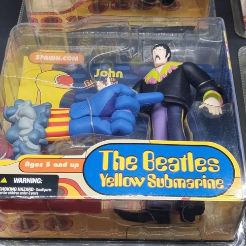 3 - The Beatles: a complete set of 4 'Yellow Submarine' action figures by McFarlane Toys, sealed in... 