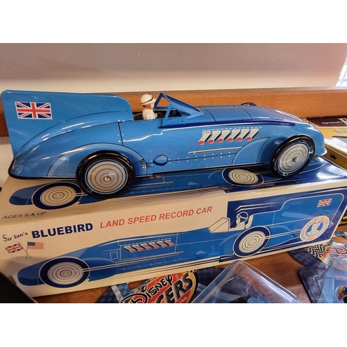 31 - Schylling: 'Sir Ian's Bluebird Land Speed Record Car', tinplate wind-up car in box; together with tw... 