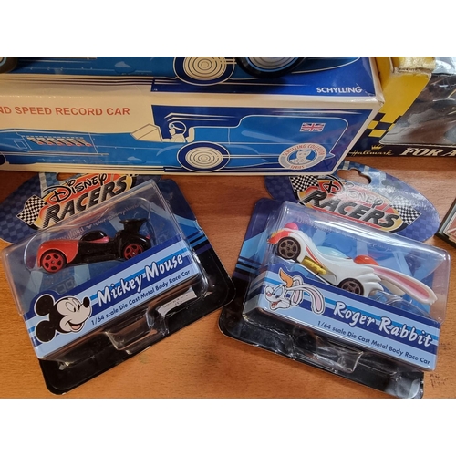 31 - Schylling: 'Sir Ian's Bluebird Land Speed Record Car', tinplate wind-up car in box; together with tw... 