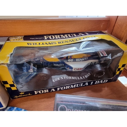 31 - Schylling: 'Sir Ian's Bluebird Land Speed Record Car', tinplate wind-up car in box; together with tw... 