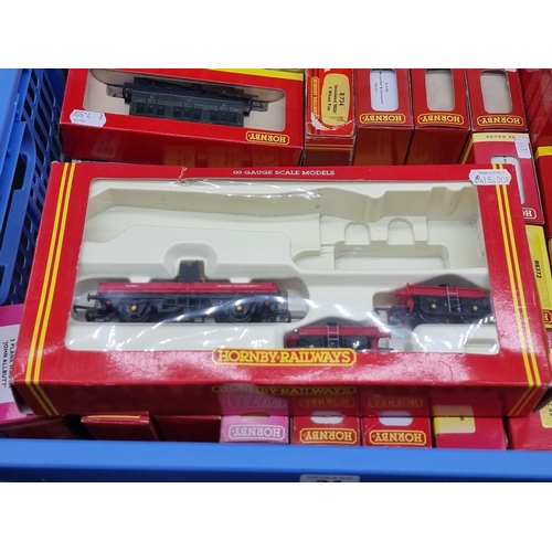 34 - Hornby: a collection of forty-two boxed wagons, hoppers, brake vans, track cleaning cars and coaches... 