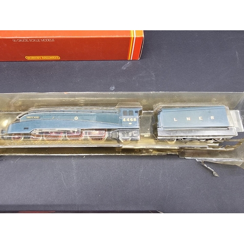 41 - Hornby: three boxed locomotives, comprising: Class 7P6F 'Britannia'; Schools Class V 'Dover', and a ... 