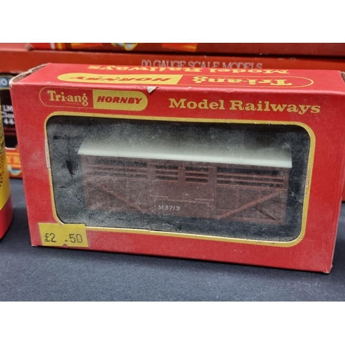 44 - Hornby: a boxed Class 5 LMS locomotive; together with another GWR tank loco; and five goods wagons, ... 