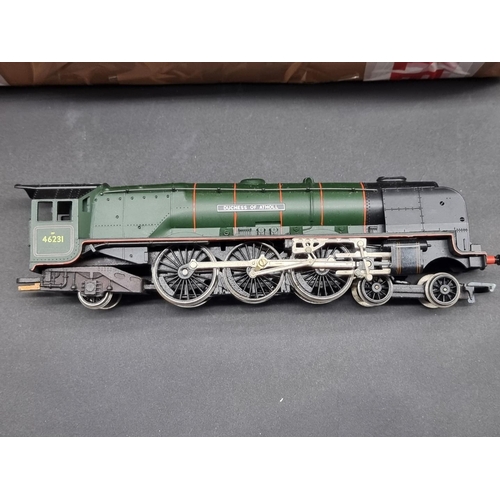 50 - Hornby: a collection of unboxed locomotives and tenders; together with a similar group of diese... 