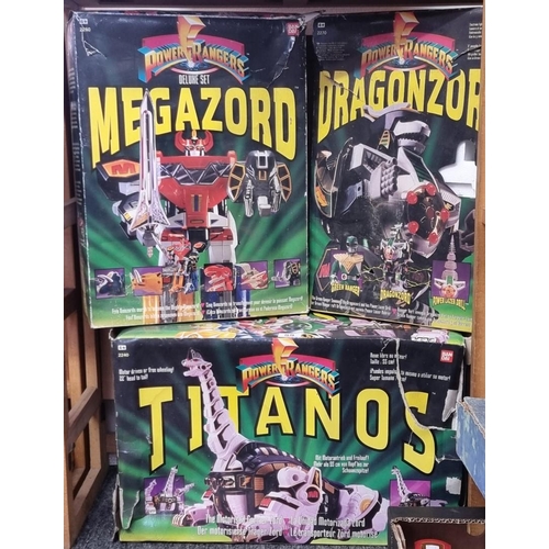 55 - Power Rangers: three vintage boxed action figures comprising, Titanos; Megazord and Dragonzord. (3)... 