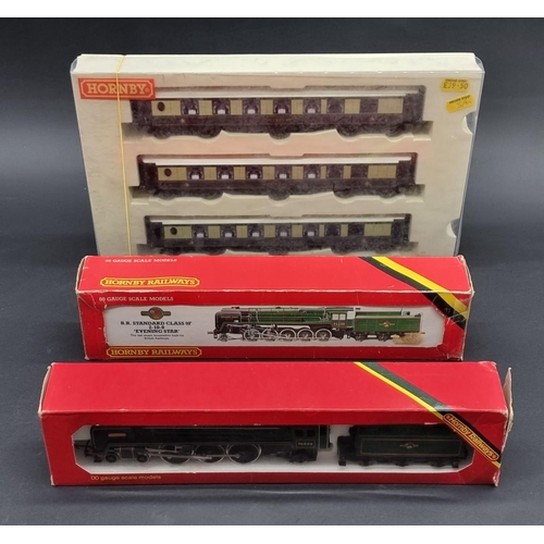 57 - Hornby: a boxed 'Britannia' locomotive; together with a set of three Pullman coaches, and anoth... 