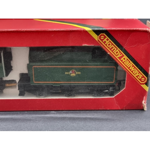 57 - Hornby: a boxed 'Britannia' locomotive; together with a set of three Pullman coaches, and anoth... 