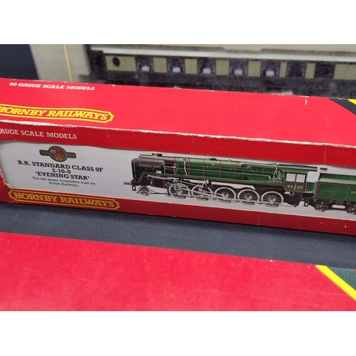 57 - Hornby: a boxed 'Britannia' locomotive; together with a set of three Pullman coaches, and anoth... 