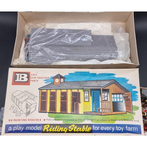 70 - Britains: a vintage riding stable kit, in original box; together with two further boxed Britain... 