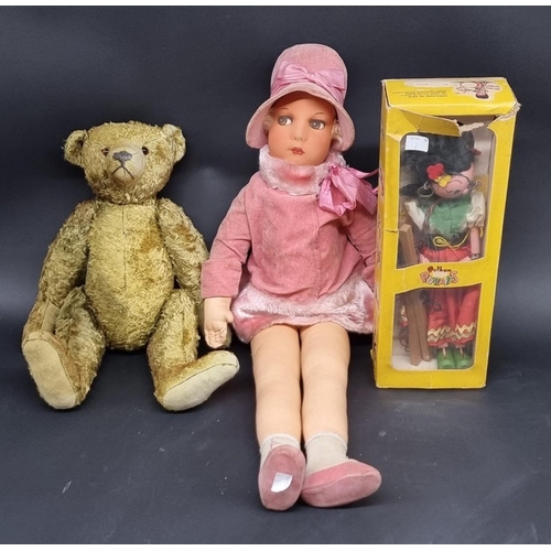 86 - Doll: a vintage cloth doll in pink fur trimmed coat and hat; together with an old green straw filled... 