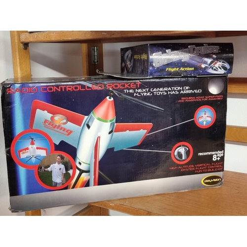 92 - Zap Toys: two boxed radio controlled cars; together with a radio controlled Starchaser rocket; a bat... 