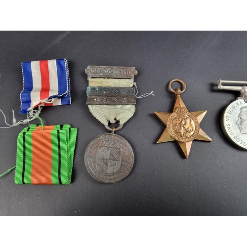 733 - Medals: a WWII group of four, in original issue box, to: R A Cooper; together with associated papers... 