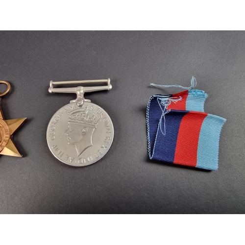 733 - Medals: a WWII group of four, in original issue box, to: R A Cooper; together with associated papers... 