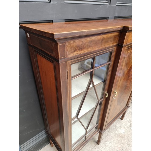 1033 - A circa 1920 mahogany and chequer strung breakfront bookcase, 137.5cm wide.