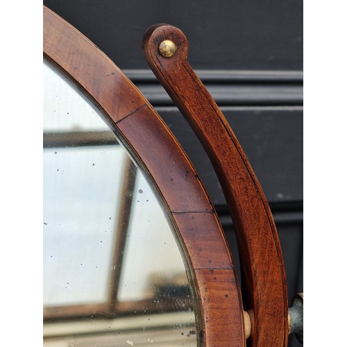 1034 - A large early 19th century mahogany and crossbanded toilet mirror, with bone escutcheon, 79cm wide.... 