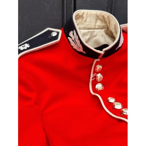 765A - A Scots Guards ceremonial tunic.