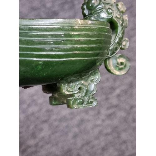 1487 - A Chinese green jade archaistic vessel, 15.5cm long; together with another hardstone figure group of... 