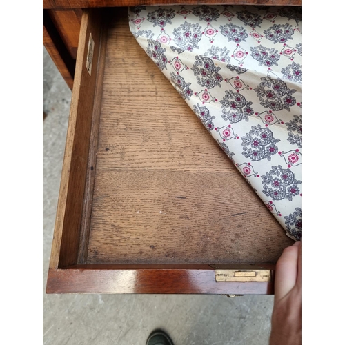 1030 - A 19th century mahogany and crossbanded sofa table, 80.5cm wide when closed.