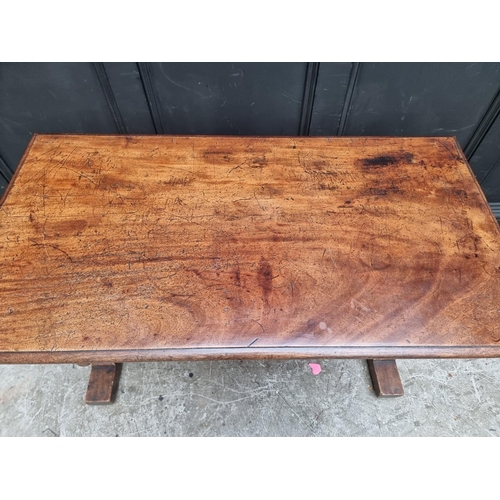 1000 - A Victorian mahogany centre table, with single drawer and trestle ends, 108cm wide.