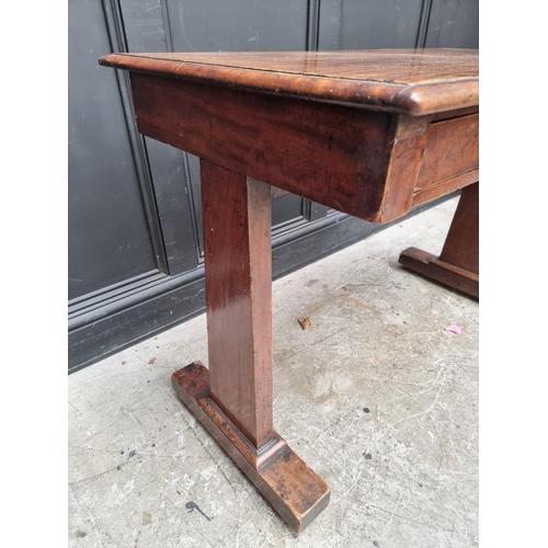 1000 - A Victorian mahogany centre table, with single drawer and trestle ends, 108cm wide.