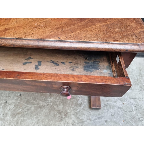 1000 - A Victorian mahogany centre table, with single drawer and trestle ends, 108cm wide.