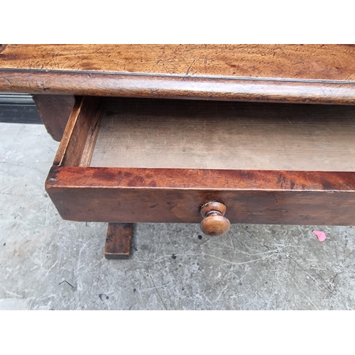 1000 - A Victorian mahogany centre table, with single drawer and trestle ends, 108cm wide.