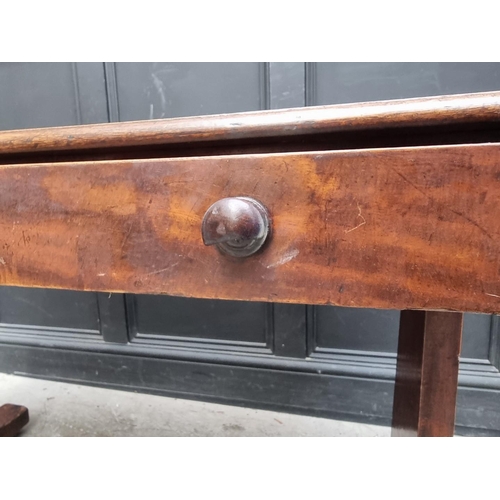 1000 - A Victorian mahogany centre table, with single drawer and trestle ends, 108cm wide.