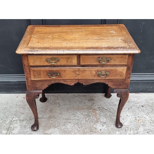 1002 - A George I/II walnut, line inlaid and crossbanded lowboy, 76cm wide.