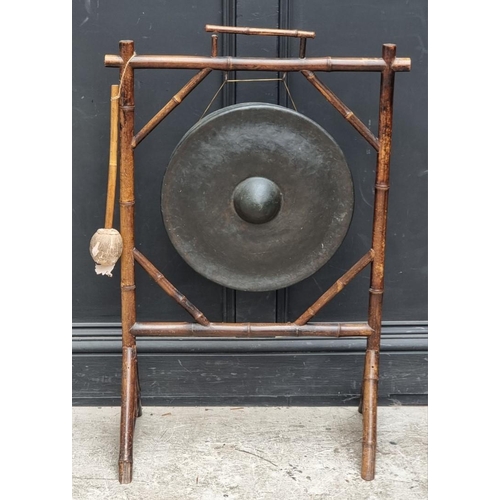 1009 - An old bamboo gong stand, total width 62.5cm, with beater.