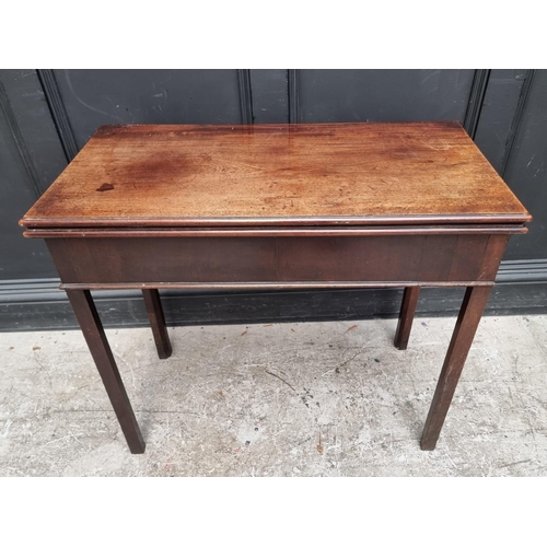 1014 - A George III mahogany tea table, 85.5cm wide.