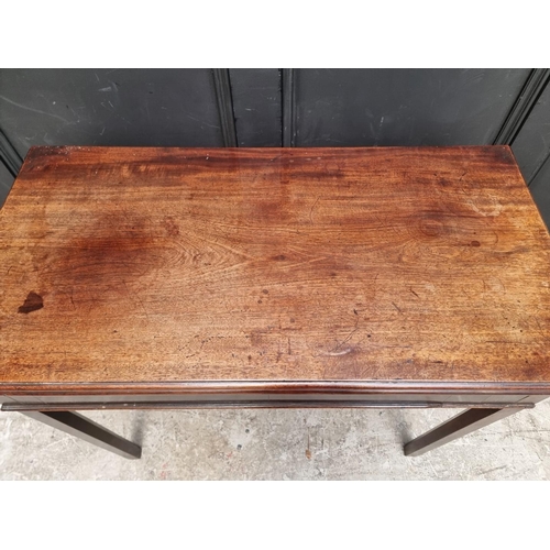 1014 - A George III mahogany tea table, 85.5cm wide.