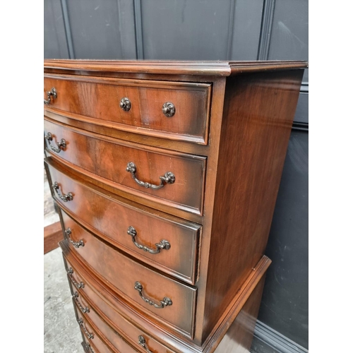 1016 - A reproduction mahogany chest on chest, 66cm wide.