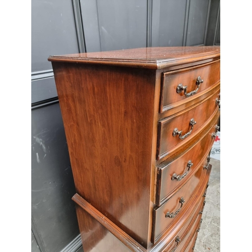 1016 - A reproduction mahogany chest on chest, 66cm wide.