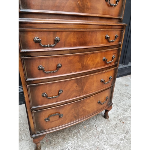 1016 - A reproduction mahogany chest on chest, 66cm wide.