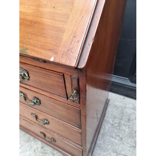 1017 - A George III mahogany bureau, with cast brass handles and escutcheons, 92cm wide.... 