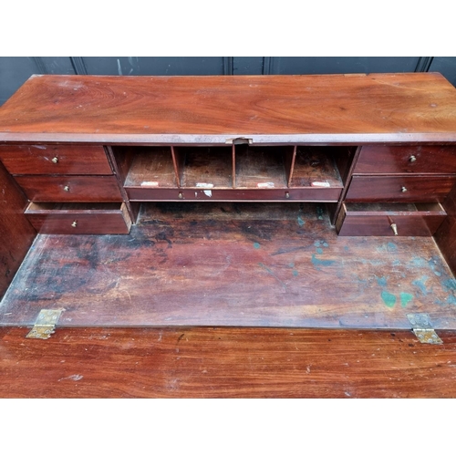 1017 - A George III mahogany bureau, with cast brass handles and escutcheons, 92cm wide.... 