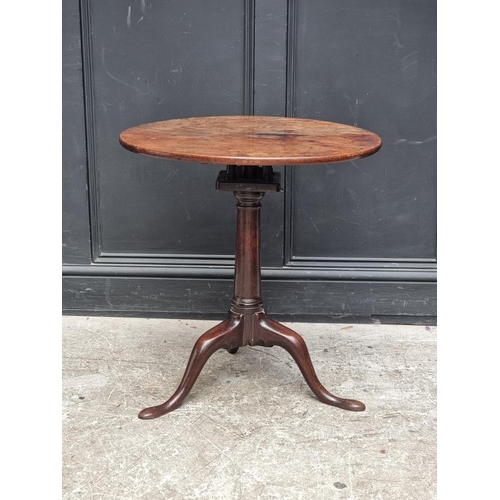 1021 - A George III mahogany circular tilt-top tripod table, with single piece top and bird-cage action, 65... 