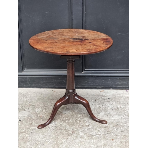 1021 - A George III mahogany circular tilt-top tripod table, with single piece top and bird-cage action, 65... 