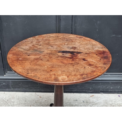 1021 - A George III mahogany circular tilt-top tripod table, with single piece top and bird-cage action, 65... 