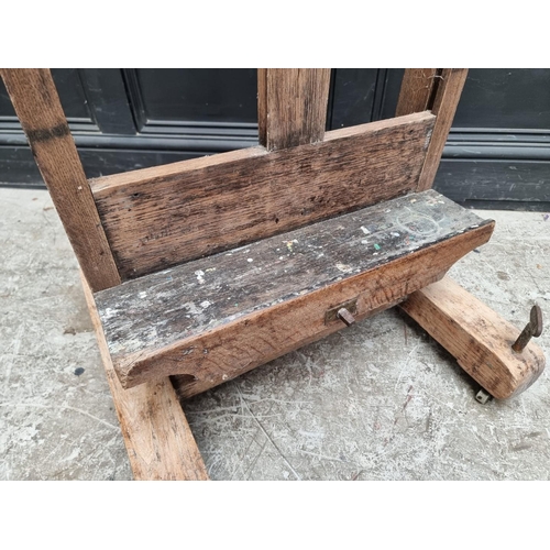 1025 - An old oak artist's easel, bearing brass plaque inscribed 'Lechertier Barbe & Co, 60 Regent St, ... 