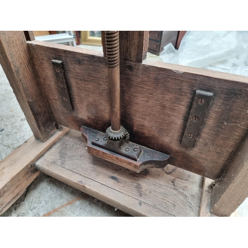 1025 - An old oak artist's easel, bearing brass plaque inscribed 'Lechertier Barbe & Co, 60 Regent St, ... 