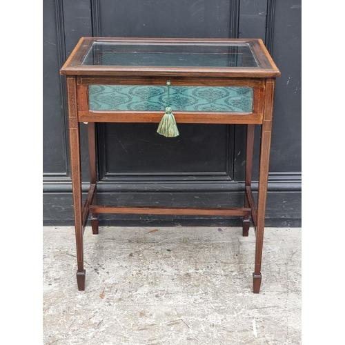 1035 - A late Victorian mahogany, line inlaid and crossbanded bijouterie table, 60.5cm wide.... 